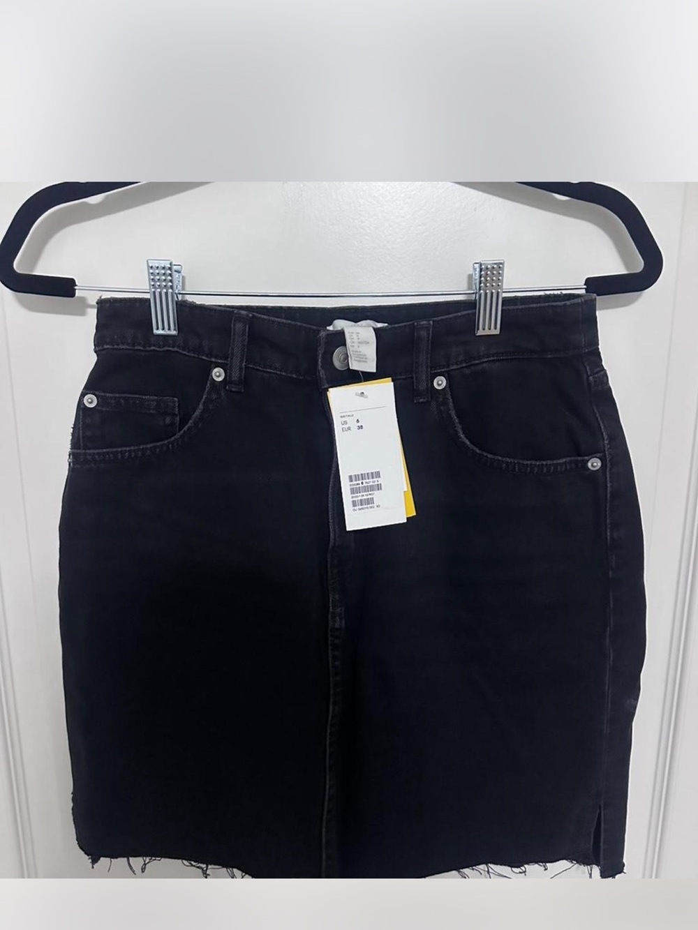 Brand new H&M Black denim mini skirt with raw hem. Size 6 but fits like a Size 4